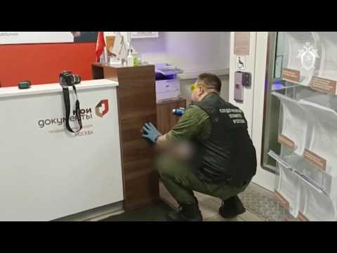 Investigators work on crime scene in Moscow office after shooter kills two