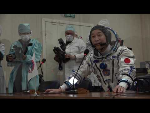 Japanese tycoon Maezawa checks spacesuit before tourist launch to ISS