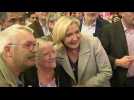 Far-right poll hopeful Le Pen campaigns on a market in southern France