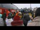 Ukrainian refugees wait for buses at Poland's border town
