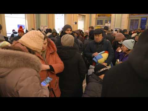 Ukrainian refugees sleep at Przemysl train station