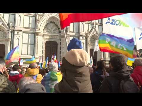 Ukrainian flags fly at anti-war protest in Florence, Italy