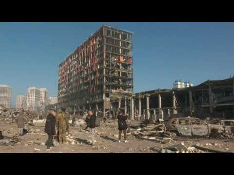 Ukraine: emergency services at shopping mall shelling site in Kyiv