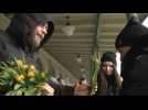 Ukrainian women refugees receive flowers for Women's Day in Polish border town