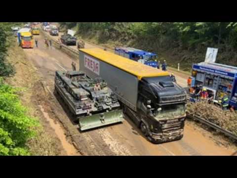 German army trucks attempts to clear roads after heavy floods