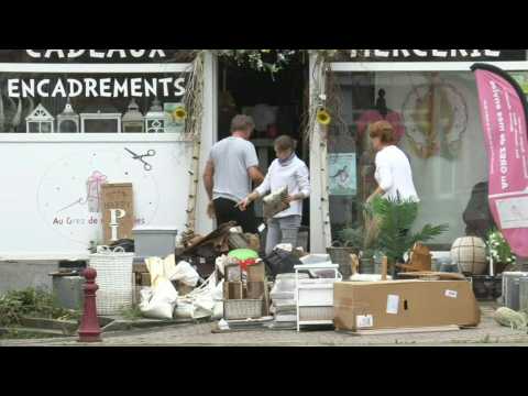 Belgium: People clear businesses, homes of mess caused by floods