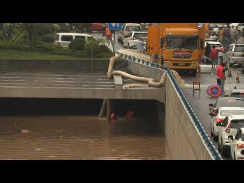 Flood aftermath: Water is pumped out of flooded tunnel in China