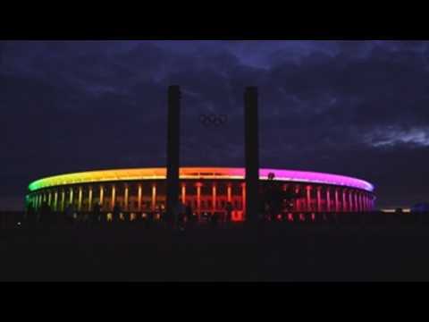 Berlin's Olympic Stadium illuminated in rainbow colors during Euro match