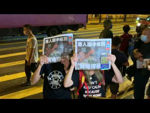 Hong Kongers queue for last edition of pro-democracy paper Apple Daily