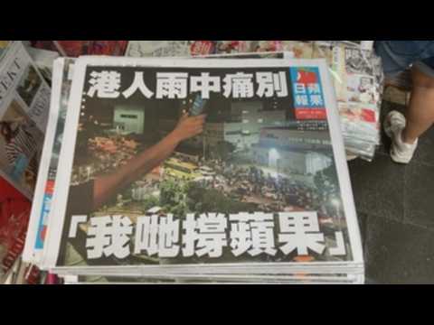 Hong Kong residents queue up in early hours for final issue of  Apple Daily