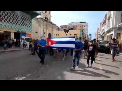 Thousands of Cubans take to streets to protest against government