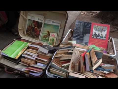 Homless in Argentina selling books in order to survive