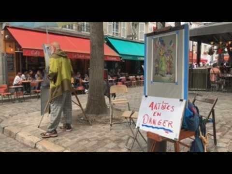 Artists protest in front of the Parisian City Hall