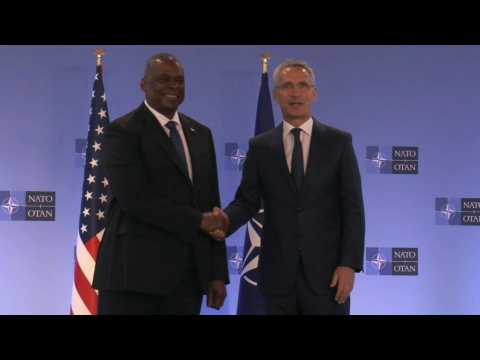 Handshake between US Secretary of Defense Austin and NATO chief Stoltenberg