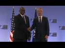 Handshake between US Secretary of Defense Austin and NATO chief Stoltenberg
