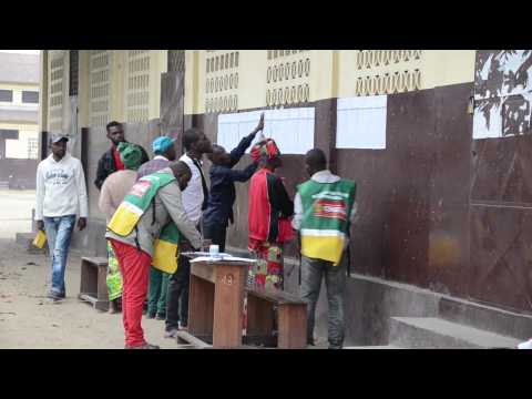 Voters cast their ballot at a polling station in Brazzaville