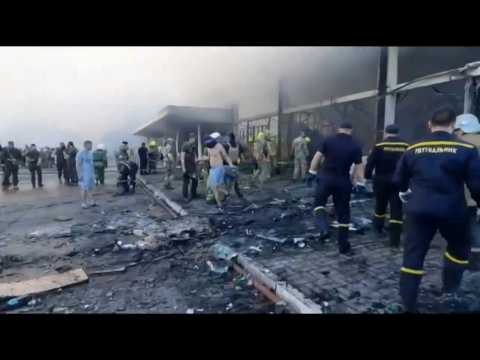 Ukrainian emergency service clear rubble at missile-hit mall