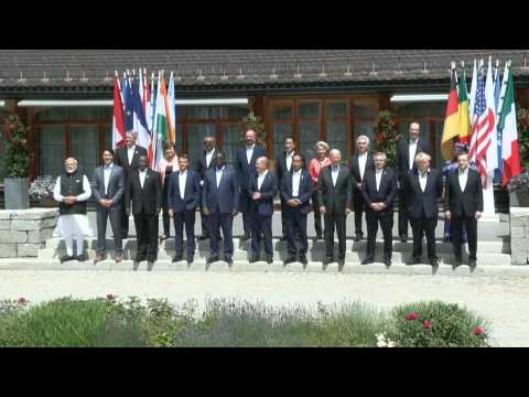 G7 leaders and guests pose for family photo