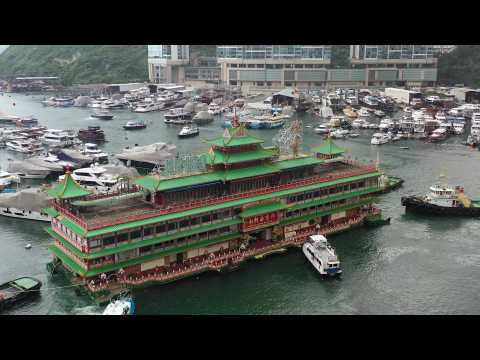 AERIAL SHOTS of Famed Hong Kong floating restaurant being towed away