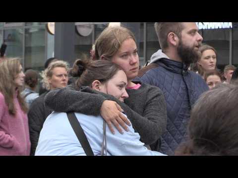 People gather in Copenhagen to pay tribute to mall shooting victims