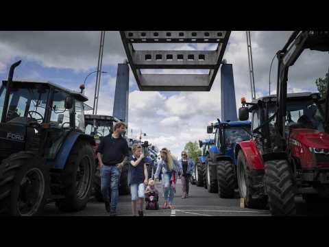 Dutch farmers and fishermen block roads to protest new emissions rules