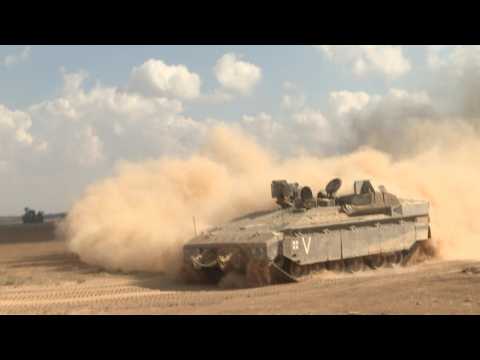 Convoy of Israeli armoured personnel carriers drive near Gaza border