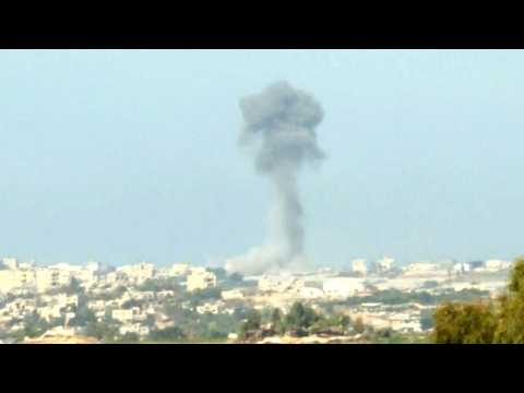 Smoke billows following Israeli strikes on northern Gaza Strip