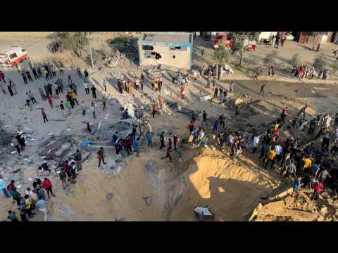 Palestinians search through rubble of destroyed building in Khan Yunis