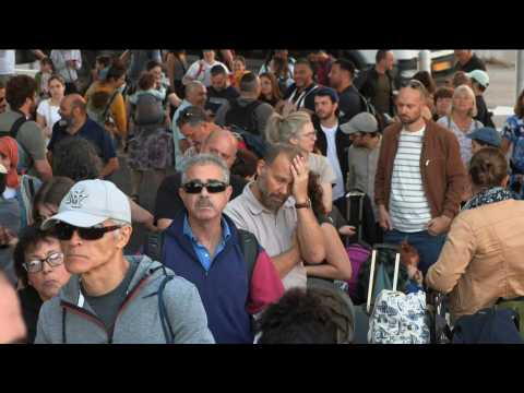People wait at Haifa port as US evacuates citizens from Israel to Cyprus