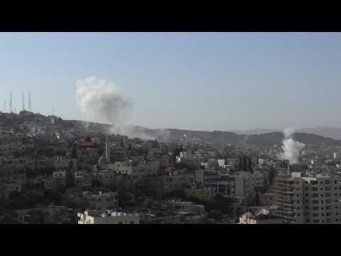 Smoke billows, gunfire rings out as Israeli army raids West Bank's Jenin