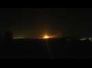 Flares and explosions over Gaza City night sky