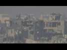 Israeli flag raised on top of destroyed building in northern Gaza