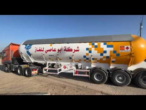 Fuel trucks enter the Rafah border crossing as truce starts