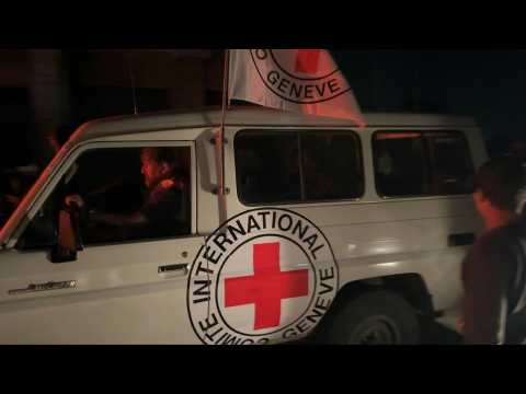 Red cross convoy transports released Gaza hostages to Egypt