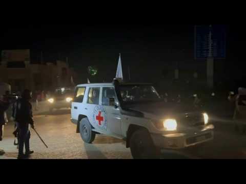 Red Cross convoy carrying released Thai and Israeli hostages crosses Rafah border to Egypt