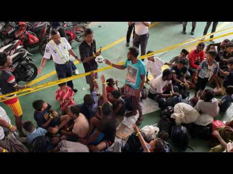 Indonesia moves rejected Rohingya refugees by truck to temporary shelter