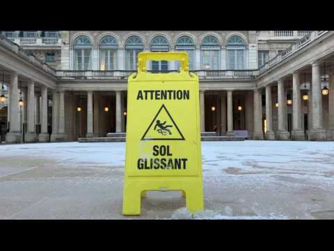 Snow cloaks the Palais Royal garden in Paris