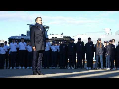 France's Macron attends flag-raising ceremony at naval base