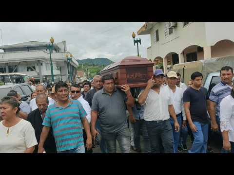 People attend funeral of prosecutor killed in Ecuador