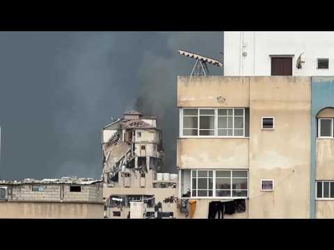 Smoke rises from destroyed building after strikes in Gaza City