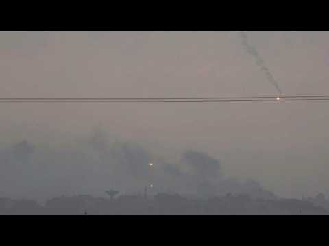 Flares seen over the northern Gaza Strip as smoke billows