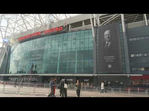 Old Trafford adorned with photos of Charlton as funeral takes place