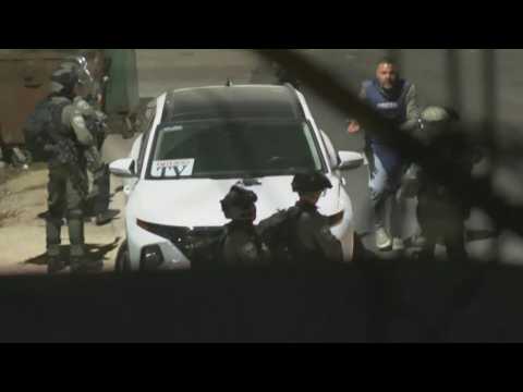 Journalists take cover as Israeli forces fire rubber bullets outside Ofer prison