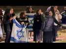 Israelis cheer as they await convoy of released hostages in southern Israel