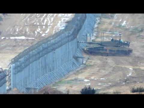 Israeli army vehicles manoeuvring on the Israel-Gaza border