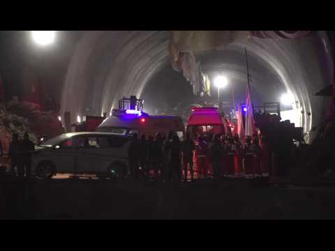 Ambulances leave tunnel entrance after Indian workers rescued