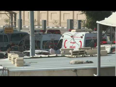 Ambulance vehicles transport wounded Gazans through Rafah crossing