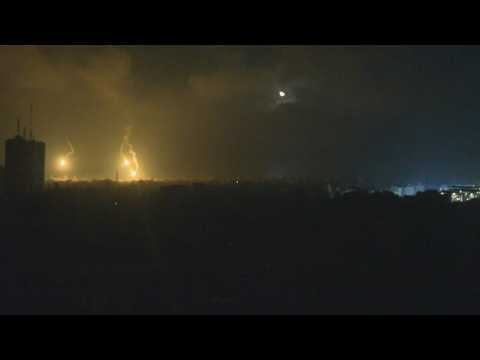 Flares descend on Gaza as Israeli warplanes pound the Palestinian territory