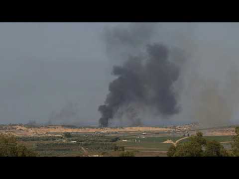 Smoke rises after munitions explode in the northern Gaza strip