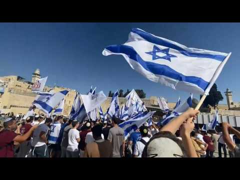 Pre-military age Israeli youth gather at the Western Wall in support of Israel